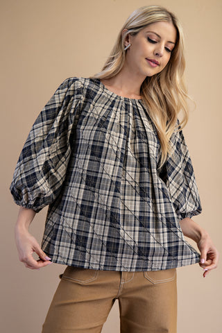 The Cozy Definition Plaid Top