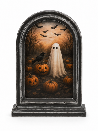 Bring a touch of vintage Halloween charm to your home with the Haunted Harvest Framed Halloween Décor. This spooky scene features a sweet ghost surrounded by pumpkins, jack-o’-lanterns, a black crow, bare trees, and bats flying overhead. The dark distressed arched frame gives it an aged, antique-inspired look that makes it perfect for creating a cozy yet spooky Halloween display.

Style it on a mantel, entryway table, shelf, or alongside your favorite fall and Halloween décor.

Details:

Vintage-inspired Ha