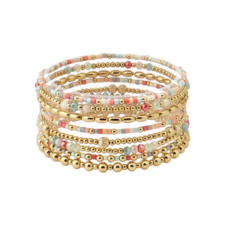 Sleek, bold, and effortlessly elevated — the Mixed Bead Bracelet Stack is the statement set your wrist has been waiting for. Designed as a coordinated set of eight bracelets, this stack features a mix of glossy beads, metallic accents, and soft pastel tones for a layered look that feels both playful and polished.

Each bracelet is crafted on a comfortable stretch band for easy wear, while the variety of textures and bead shapes creates dimension and visual interest. 