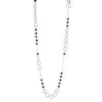 Bold yet effortlessly wearable, the Midnight Orbit Mixed Metal Necklace features an eye-catching combination of silver open circles and black beaded accents for a modern layered look. The mixed textures and contrasting tones create a versatile statement piece that pairs beautifully with both casual outfits and dressier styles. Wear it solo or layer it with your favorite necklaces for added dimension.

Mixed metal silver-tone design
Black bead accents throughout
Open circle link details
Lightweight statement