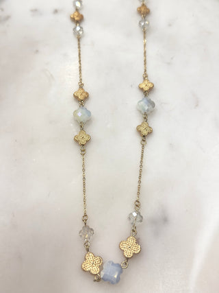 Soft shimmer meets timeless elegance with this gold-tone long station necklace. Featuring textured clover accents paired with faceted crystal beads in soft, luminous hues, this piece adds subtle sparkle and graceful detail to any look. Lightweight and easy to wear, it’s perfect styled on its own or layered with shorter favorites for a polished, everyday finish.