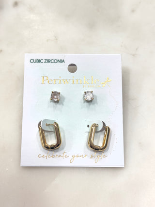Timeless shine meets everyday versatility with this chic two-pair earring set. Featuring sleek gold-tone oval hoops paired with classic cubic zirconia stud earrings, this set offers the perfect mix of polished simplicity and subtle sparkle. Lightweight and easy to wear, these earrings can be styled together or separately for effortless, everyday elegance.