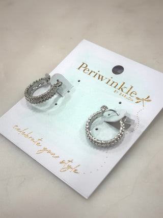 Add instant sparkle to your everyday look with the Shimmer Stack Hoops. Featuring layered, textured detailing that catches the light from every angle, these hoops bring just the right amount of glam without feeling over-the-top. Lightweight and easy to wear, they’re perfect for dressing up a tee or finishing off a night-out outfit.

Available in gold or silver, these hoops are a must-have for anyone who loves subtle shine with a little extra edge.

Details

Layered textured hoop design

