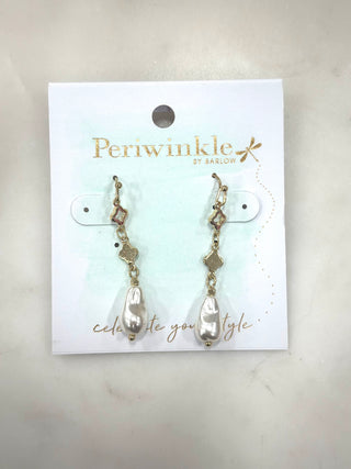 Elegant with a touch of modern charm, the Soft Luster Drop Earrings feature organic-shaped pearl drops suspended from delicate gold-tone links. The mixed geometric accents add subtle interest while the fluid pearl shape brings timeless softness. Lightweight and beautifully dangly, these earrings dress up everyday looks and pair effortlessly with special occasions.

Details
• Dangly drop earring design
• Organic-shaped pearl accents
• Gold-tone chain and geometric links
• Lightweight + comfortable