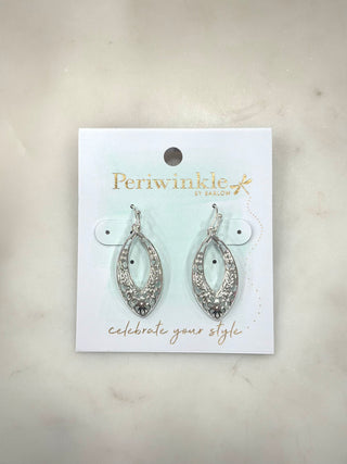 Delicate and beautifully detailed, the Silver Garden Filigree Drop Earrings feature an airy openwork design with soft floral accents woven throughout. The elongated silhouette adds elegant movement, making these a lightweight yet eye-catching option for everyday wear or dressed-up moments.

Details
• Dangly drop earring design
• Intricate silver-tone filigree detailing
• Floral-inspired openwork pattern
• Lightweight and comfortable
• Fish hook backing
• Elegant elongated shape

