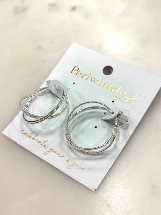 The Double Shine Hoop Earrings are a modern twist on a classic favorite. Featuring a layered double-hoop design with subtle sparkle detailing, these earrings add dimension and shine without feeling heavy. Lightweight and easy to wear, they’re perfect for everyday styling or dressing up a simple look.

Available in Silver or Gold, making them a versatile staple for any jewelry collection.

DETAILS:

Double hoop design

Lightweight and comfortable

Smooth and textured sparkle finish

