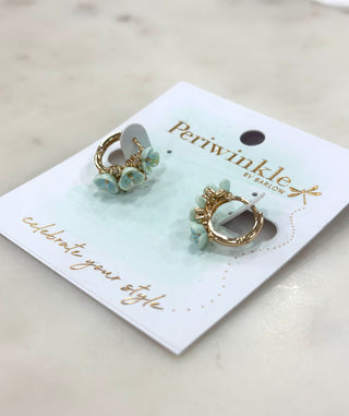 The Petal Bloom Huggie Earrings feature delicate floral details accented with soft, light blue petals for a fresh and feminine look. Designed in a comfortable huggie style, these earrings are lightweight and easy to wear while adding a subtle pop of color. Perfect for everyday outfits or adding a sweet touch to dressier looks.

DETAILS:

Floral accent huggie earrings

Light blue petal details

Lightweight and comfortable

Gold-tone finish

Huggie closure
