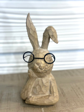 Add a touch of personality and Easter charm to your décor with the Professor Bunny Easter Figurine. Featuring an adorable bunny design complete with round glasses and a cozy seated pose, this piece brings a playful yet stylish feel to your Easter displays. Perfect for shelves, mantels, tiered trays, or tabletops, this bunny adds character and whimsy to your spring décor.

DETAILS:

Easter bunny figurine with glasses detail

Neutral, lightly textured finish

Freestanding and easy to style

