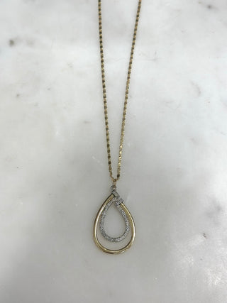 Elevate your everyday style with our Linked In Luxe Teardrop Necklace ✨ Featuring a modern layered teardrop pendant with shimmering accents, this necklace brings the perfect mix of elegance and versatility. Whether worn alone or layered with your favorite pieces, this timeless design adds effortless sparkle to any outfit.

DETAILS:
• Layered teardrop pendant design
• Lightweight statement necklace
• Adjustable chain closure
• Available in Gold, Silver, and Gold & Silver
• Perfect for everyday wear or dressi