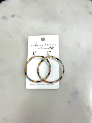 Add the cutest pop of color to your accessory collection with our Color Pop Beaded Hoop Earrings ✨ These lightweight hoops feature a fun mix of colorful beads with gold accents for the perfect playful statement. Easy to style with everything from graphic tees to vacation looks, these earrings are sure to brighten any outfit.

DETAILS:
• Lightweight beaded hoop earrings
• Multi-color bead detailing
• Gold accent hardware
• Fish hook backing
• Fun everyday statement piece
• Perfect for spring, summer, and vac