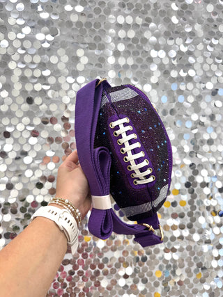 Bring the glam to game day with our Sparkle &amp; Score Football Crossbody Bag! Shaped like a football and covered in dazzling rhinestones, this statement bag is made for fans who love a little sparkle with their team spirit. The adjustable strap keeps it comfortable to carry, while the roomy interior holds your essentials for tailgates, stadium nights, and celebrations under the lights.

Football-shaped crossbody bag
Covered in shimmering rhinestone embellishments
Top zipper closure
