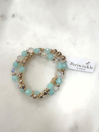 Soft aqua tones meet delicate sparkle in this effortlessly chic stretch bracelet. Featuring faceted aqua beads mixed with crystal accents and warm gold-tone details, this piece adds a fresh pop of color and subtle shine to any look. Easy to slip on and comfortable for all-day wear, it’s perfect worn solo or stacked with other favorites for an elevated everyday vibe.