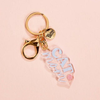 Show off your love for your furry best friend with this adorable acrylic keychain. Designed for both dog moms and cat moms, it’s the perfect little accessory to add personality to your keys, tote, or everyday bag. Cute, lightweight, and easy to clip on—this one is a must-have for every pet lover.

Details:

Durable, lightweight acrylic
Gold-tone hardware with lobster clasp & split keyring
Swivel attachment for easy use
Includes signature logo charm
Perfect for keys, bags, or backpacks
Available in Dog Mom &