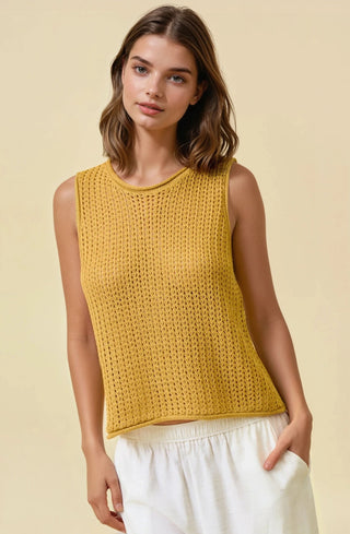 Light, airy, and endlessly versatile — the As It Was Open Stitch Sweater Tank is the perfect warm-weather knit. Designed with an open stitch pattern, this sleeveless sweater offers breathable comfort while giving a subtle peek of what’s underneath. It’s an easy layering piece that feels relaxed yet polished.

The classic round neckline and boxy silhouette create a modern, effortless fit, while ribbed trim at the neckline, armholes, and hem adds structure and helps the top keep its shape.