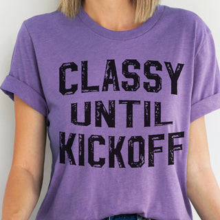 Sweet, stylish, and just a little competitive—our Classy Until Kickoff Tee is made for every football fan who knows the game can bring out their spirited side! Featuring a playful graphic on a soft heather purple tee, this top is perfect for tailgates, game day parties, cheering from the stands, or watching from the couch.

