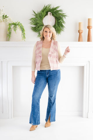 Step out in effortless style with the Uptown Stroll Plaid Vest — the perfect lightweight layering piece to add personality and polish to any outfit. Designed with an open-front silhouette, this sleeveless vest brings a fun pop of plaid while keeping your look relaxed and easy.

Featuring functional slit pockets with outer flap detailing, it blends practicality with boutique charm. The breezy, lightweight feel makes it ideal for layering over long sleeves, tees, or sweaters during transitional seasons.