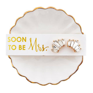 Thoughtful, elegant, and ready to gift—this trinket tray and earrings set is the perfect way to celebrate your bridal party. Designed with a delicate ceramic dish paired with coordinating earrings, it’s a keepsake your bridesmaids will love long after the big day. Perfect for holding jewelry, rings, or small treasures, this set adds a sweet and meaningful touch to getting-ready moments and beyond.

Details:
• Includes trinket tray + matching earrings
• Material: Ceramic + Zinc Alloy
• Size: 3" diameter
•