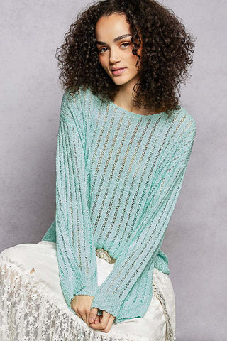 Wrap yourself in effortless elegance with the Amour & Grace Sweater — a timeless, easy-to-style piece that transitions seamlessly from cozy nights in to chic everyday outings. Designed with a relaxed silhouette, this open-weave sweater delivers breathable comfort with just the right amount of drape.

Featuring a classic round neckline and long sleeves, it’s perfect for layering over tanks or bralettes or wearing solo for an airy, laid-back look. The soft knit blend offers lightweight warmth.