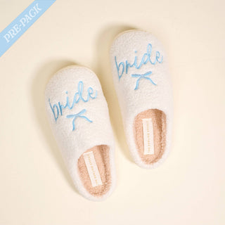 Thoughtfully created to pair beautifully with our Say I Do: Bridal Collection, these fuzzy slippers are the perfect mix of comfort and charm. Ultra-soft and plush from the inside out, they bring a cozy, elevated feel to getting ready moments, relaxing nights, or everyday lounging. Finished with a sweet bow detail, they add just the right touch of feminine style while keeping every step soft and cloud-like.

Details:

Women’s sizing:
S/M: 5–7.5
M/L: 8–10
Soft, fuzzy material inside and out
Lightweight design