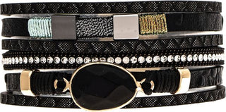 Bold, sparkling, and effortlessly stylish, the Midnight Glam Wrap Bracelet features layered black bands accented with shimmering rhinestones, textured details, and a striking faceted black centerpiece. Designed with an easy magnetic closure, this statement bracelet offers the look of multiple stacked bracelets in one chic piece.

Multi-layer wrap bracelet design
Faceted black center stone accent
Rhinestone and metallic detail accents
Magnetic closure for easy on and off
Lightweight and comfortable fit
