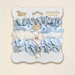 Add a sweet, stylish touch to your everyday hair routine with this charming scrunchie set from our Say I Do: Bridal Collection. Designed in the delicate Something Blue pattern, each scrunchie features soft fabric and dainty charms that bring just the right amount of sparkle—perfect for bridal moments or everyday wear.

Details:

Soft, stretchy scrunchies with coordinating charm accents
Lightweight charms add a subtle, stylish touch
Gentle on hair with a comfortable hold
Perfect for ponytails, buns, or wrist