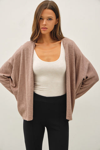 Meet your new layering favorite — the Soft Chaos Cardigan. Effortless, airy, and beautifully relaxed, this open-knit cardigan is designed to bring texture and movement to any outfit. Its lightweight feel makes it perfect for year-round layering, whether you’re tossing it over a tee, tank, or dress for that easy, put-together look.

With its softly draped silhouette and perfectly imperfect knit, this piece delivers cozy vibes without feeling heavy. It’s the kind of cardigan you’ll reach for again and again.